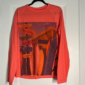 Great condition and quality long sleeve T-shirt with pocket accent!
